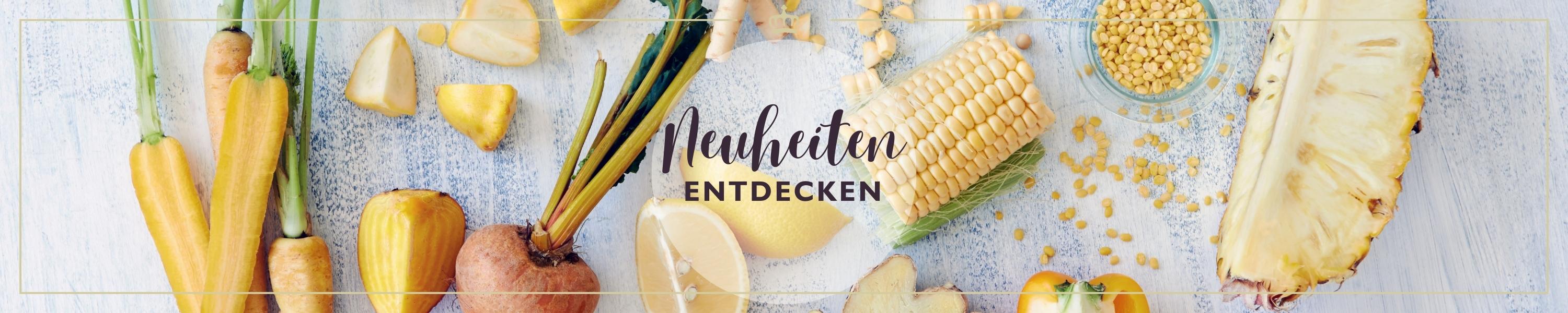 Eine Auswahl an frischem Gemüse und Obst mit Text 'Neuheiten entdecken' darauf