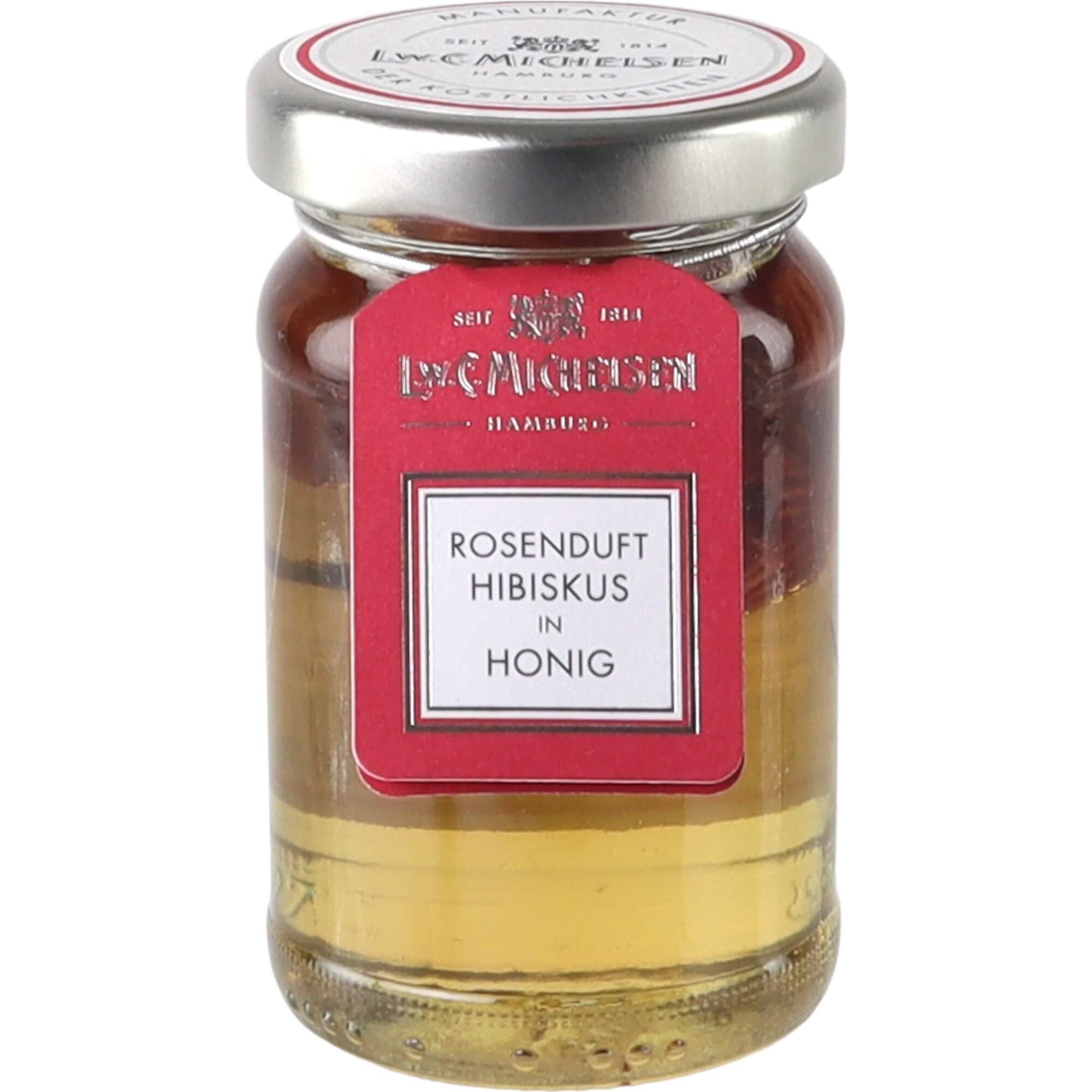 Hibiskusblüte in Honig -klein-: Tauchen Sie ein in die Welt des feinen Geschmacks mit unserem Confiserie-Honig, veredelt mit...