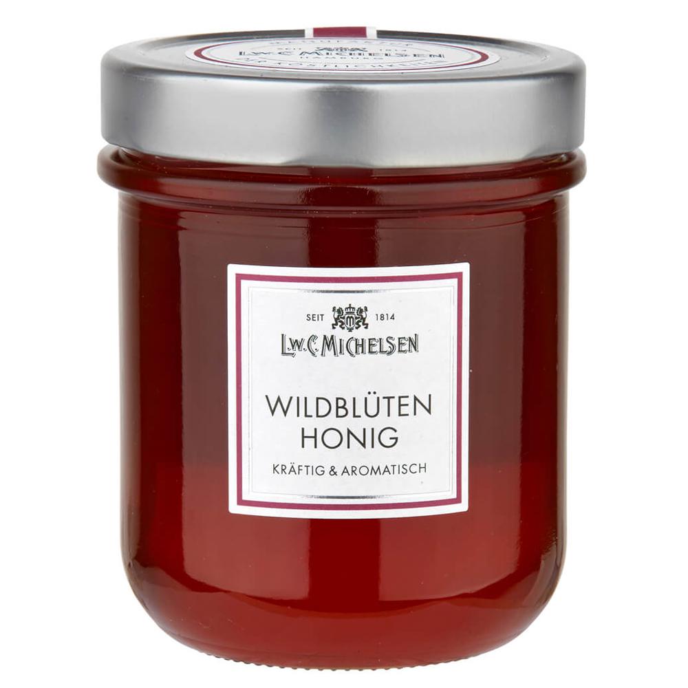 Wildblüten-Honig -Löffelglas- 500g: Tauchen Sie ein in die Welt des L.W.C. Michelsen Wildblüten-Honigs, der seit über 200...